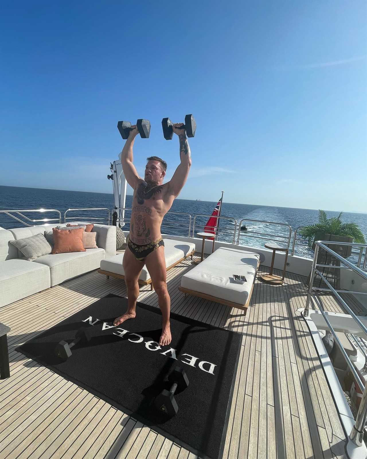 Fans of Conor McGregor say, 'What a life!' as the UFC star lifts heavy weights on his PS3m Superyacht in his Y fronts.
