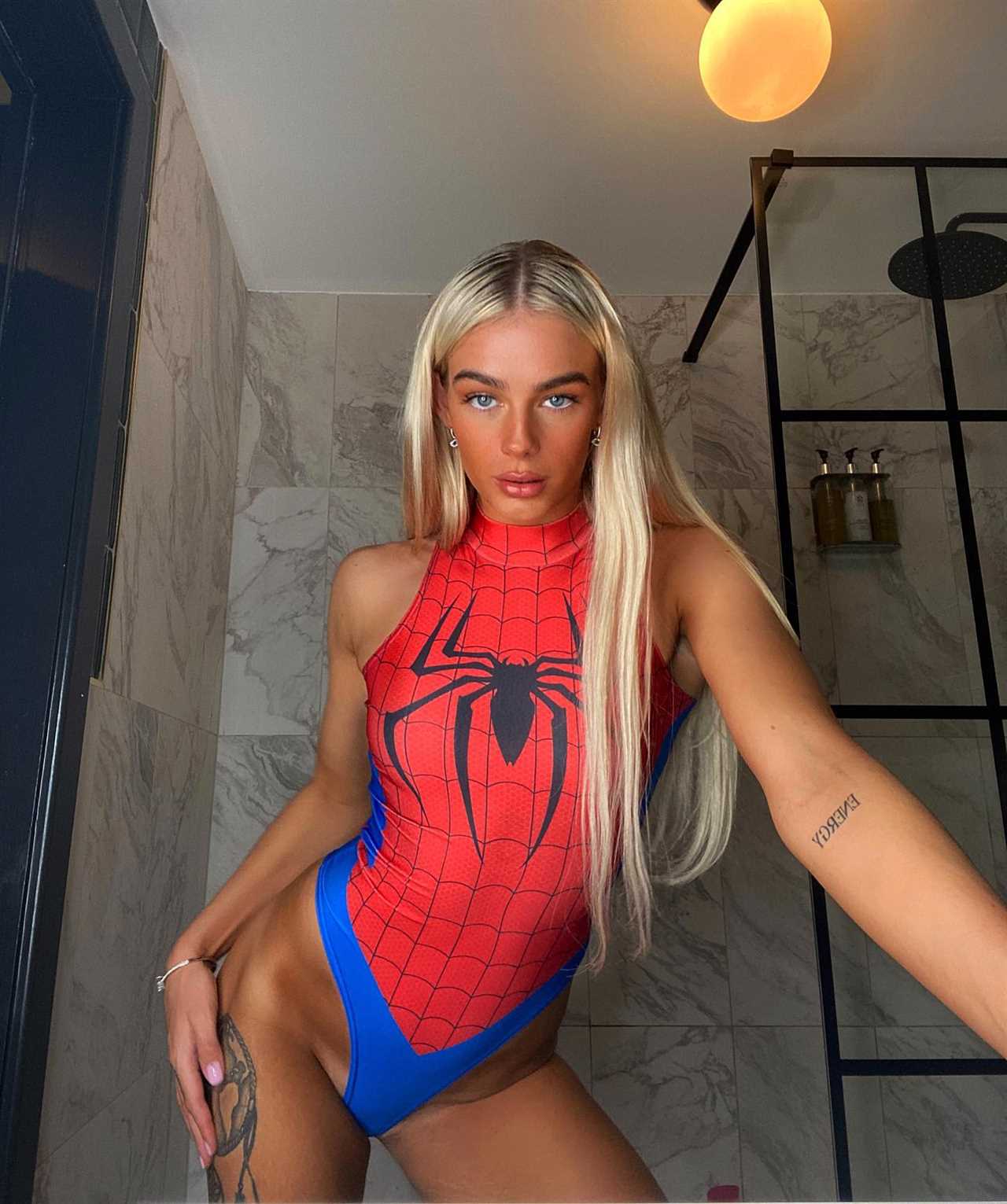 MMA and OnlyFans' star reveals that she is 'working hard, but playing even harder' before slamming trolls in a cheeky holiday message