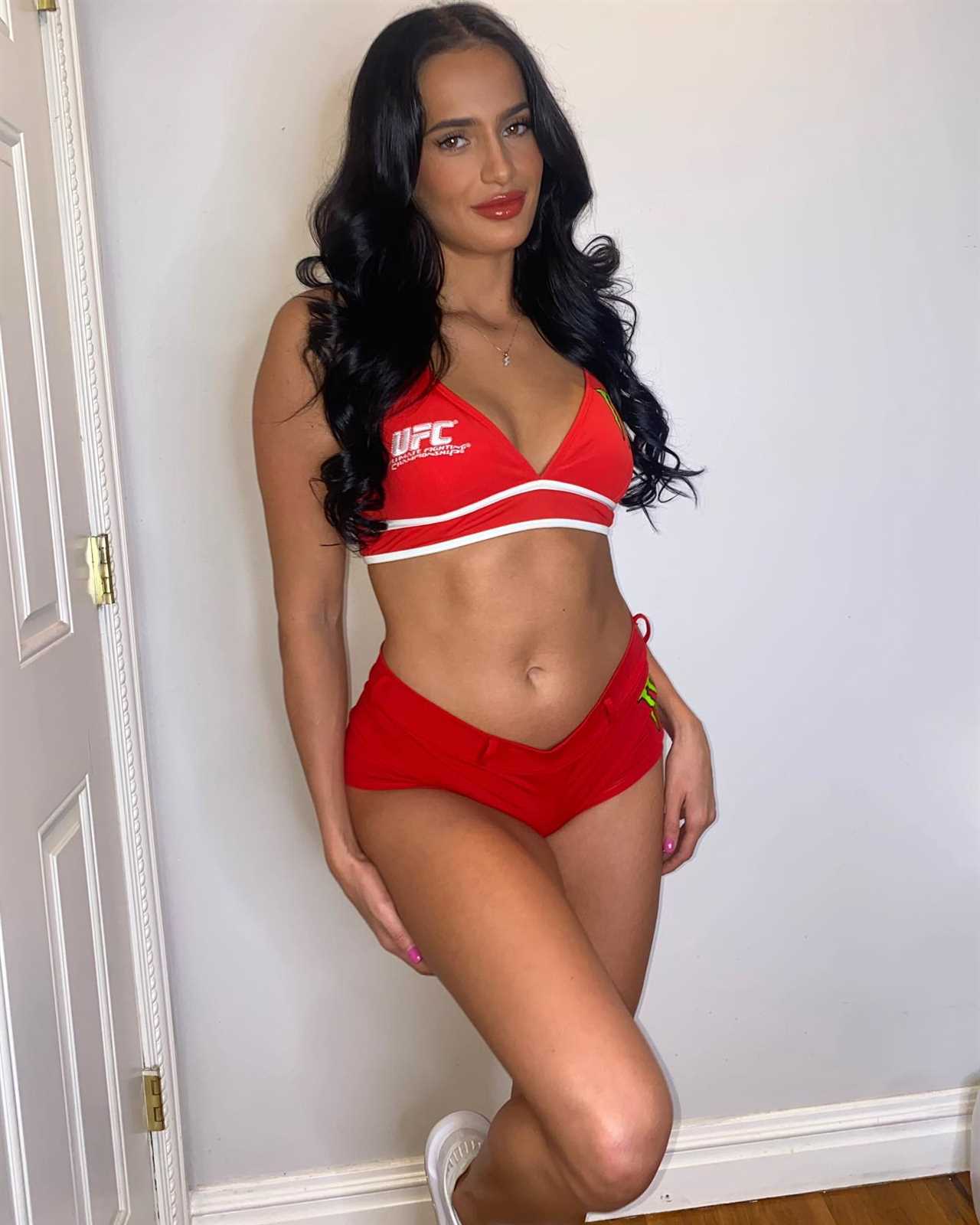 MMA fighter, aka 'beautiful champ', shows off glamorous transformation with mini dress and heels following octagon victory