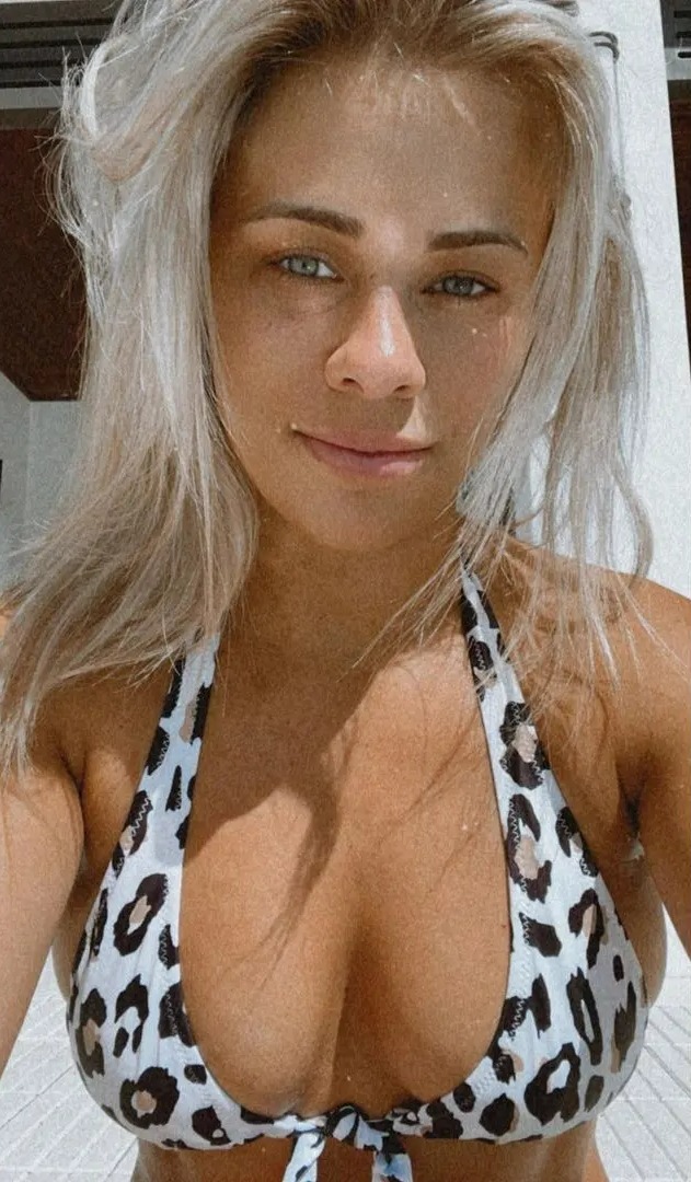 Paige VanZant, ex-UFC fighter, is dubbed 'absolutely stunning' after she shows off her bum in a string bikini during a steamy photoshoot