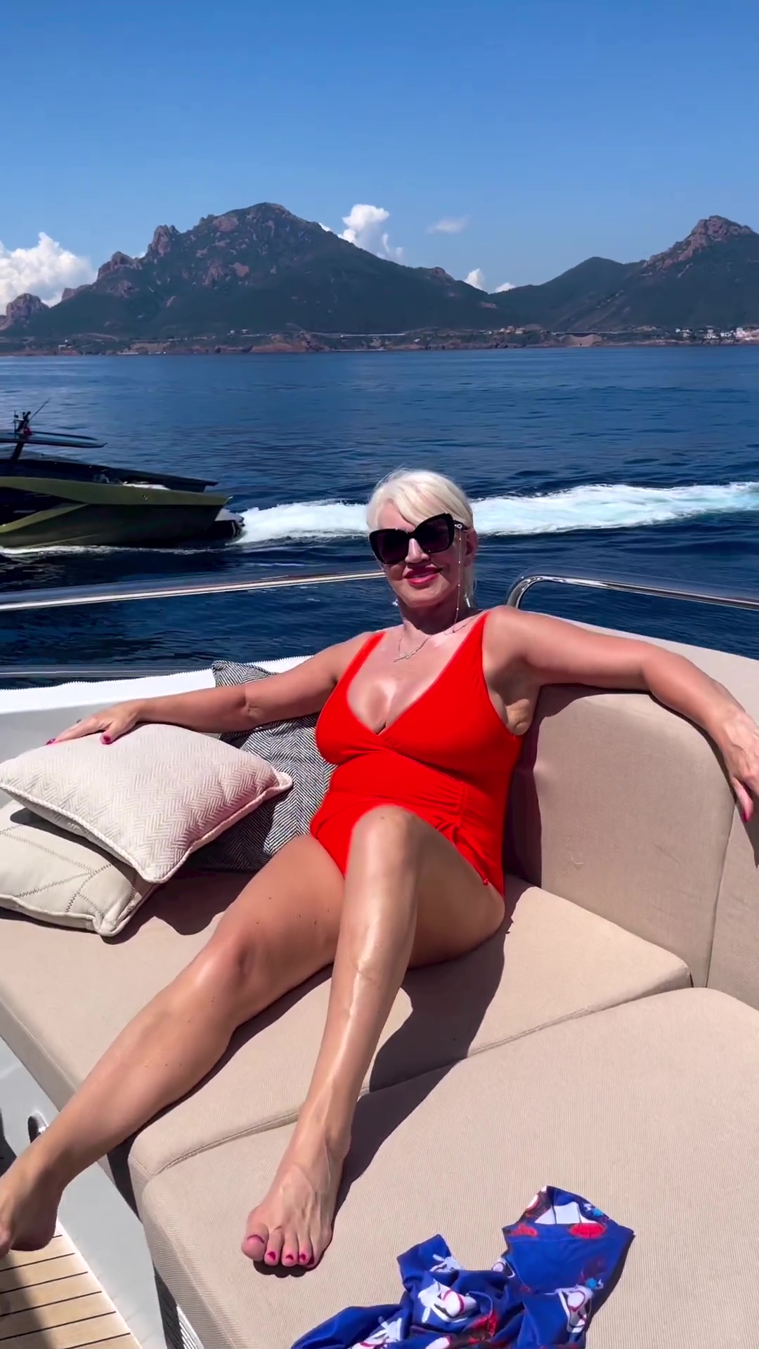 Conor McGregor, his mother and their PS3m superyacht 'Ocean Dave’ relax... while his PS2.7m Lamborghini cruises by.