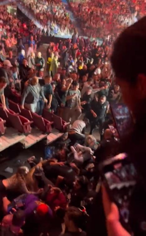 UFC 289 spectators almost fall on fighter doing octagon walking as railing collapses.