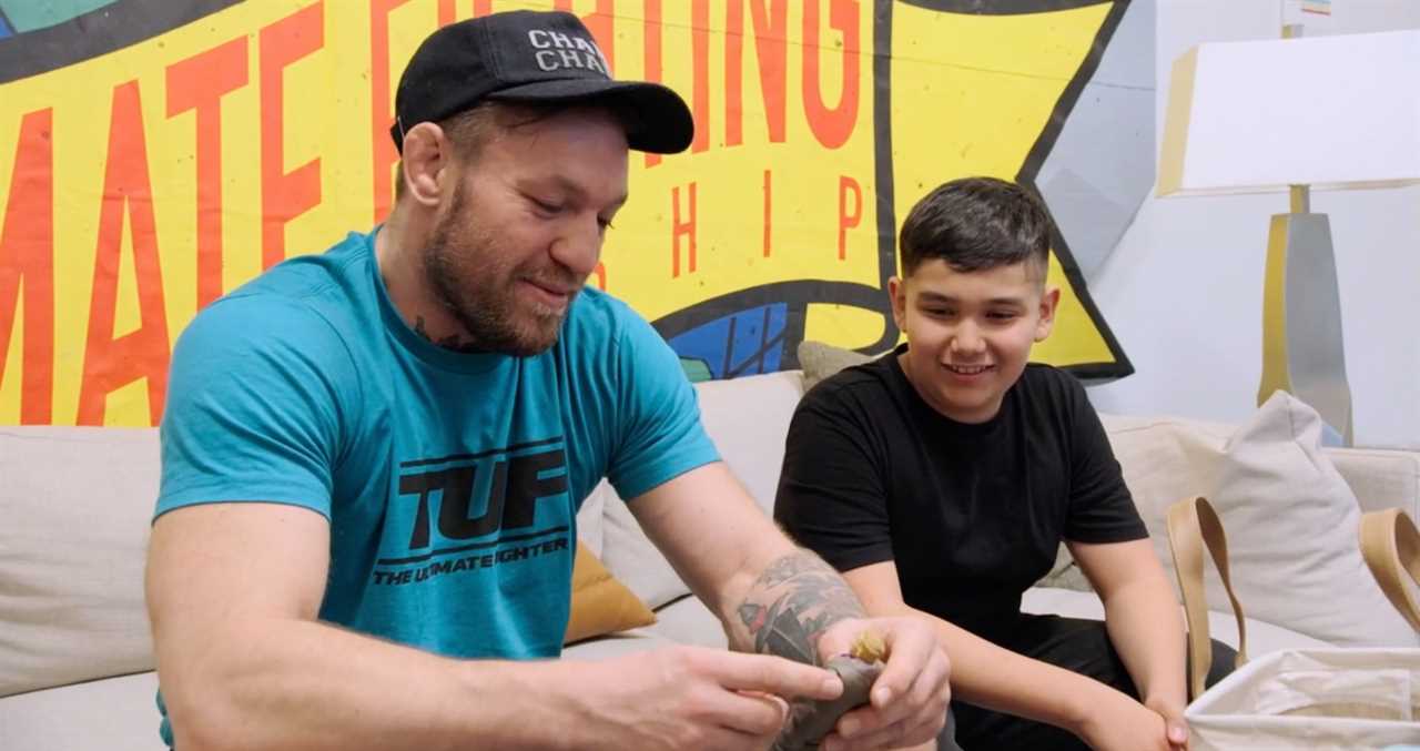 Conor McGregor gives a young UFC fan a gift of action figures worth PS1,000 during TUF 31, a classy gesture.