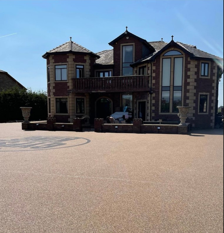 Tyson Fury shares pictures of his amazing mansion and the huge Gypsy King Logo embedded in his driveway.