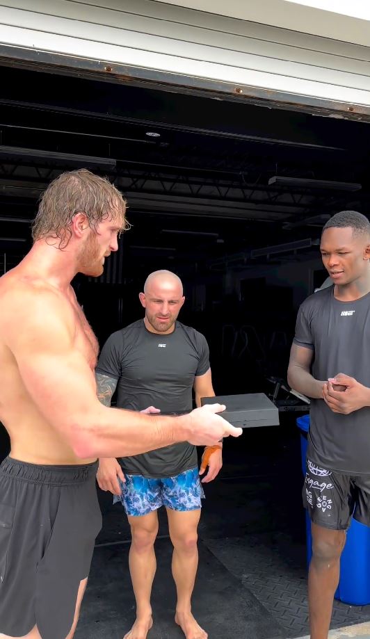 Fans notice UFC pair's unimpressed response when Logan Paul gives them Prime chains, saying 'bro doesn't think they care.'