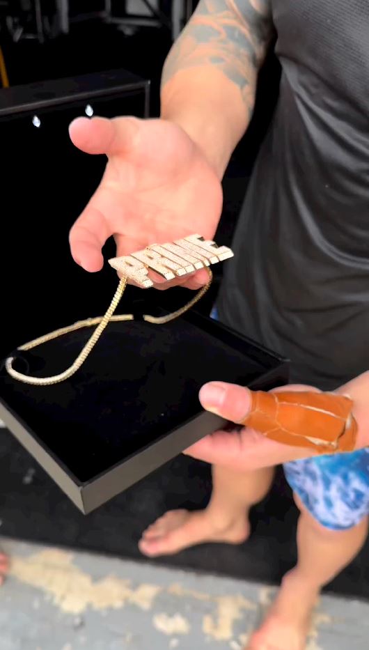Fans notice UFC pair's unimpressed response when Logan Paul gives them Prime chains, saying 'bro doesn't think they care.'
