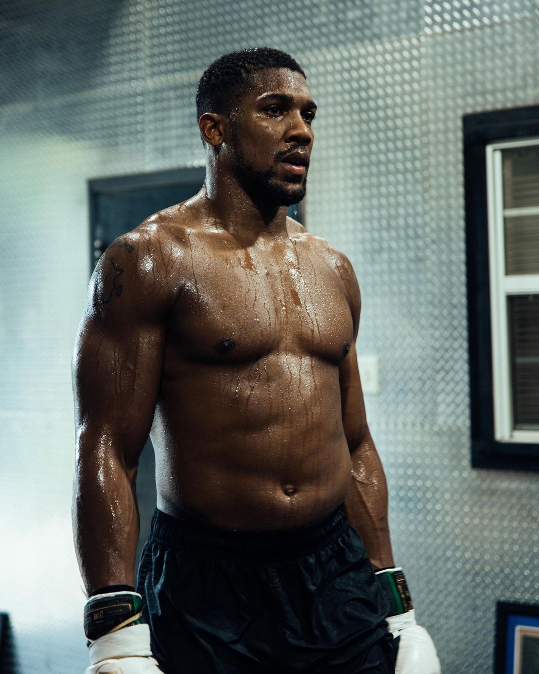 Anthony Joshua's hulking physique after sweaty workout is impressive, but he may have to wait months for his next fight