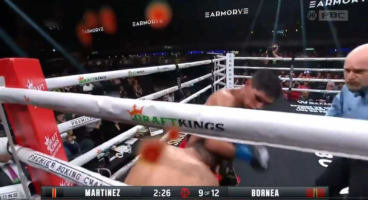 Boxing fans are horrified to see blood splattered on the ringside camera after a fighter's ear EXPLODES during a brutal fight
