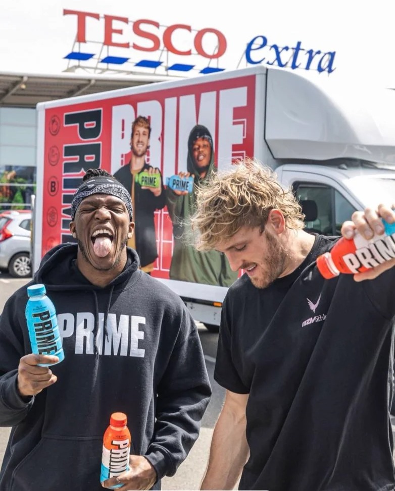 Watch KSI & Logan Paul getting pelted by bottles of Prime during drinks launch. Security rushes in to protect the pair