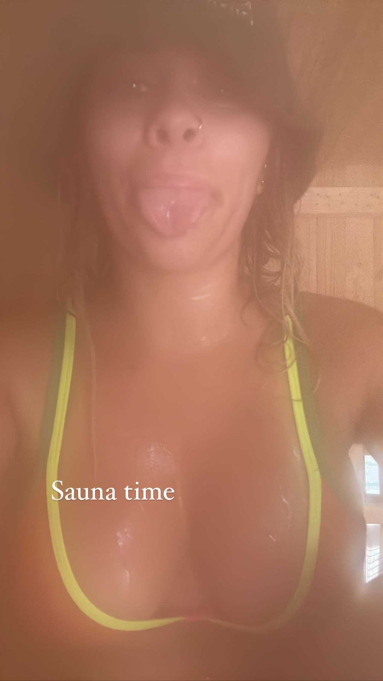 Paige VanZant, ex-UFC and OnlyFans Star, works up a good sweat in the sauna. She pokes her tongue out in a cheeky photo.
