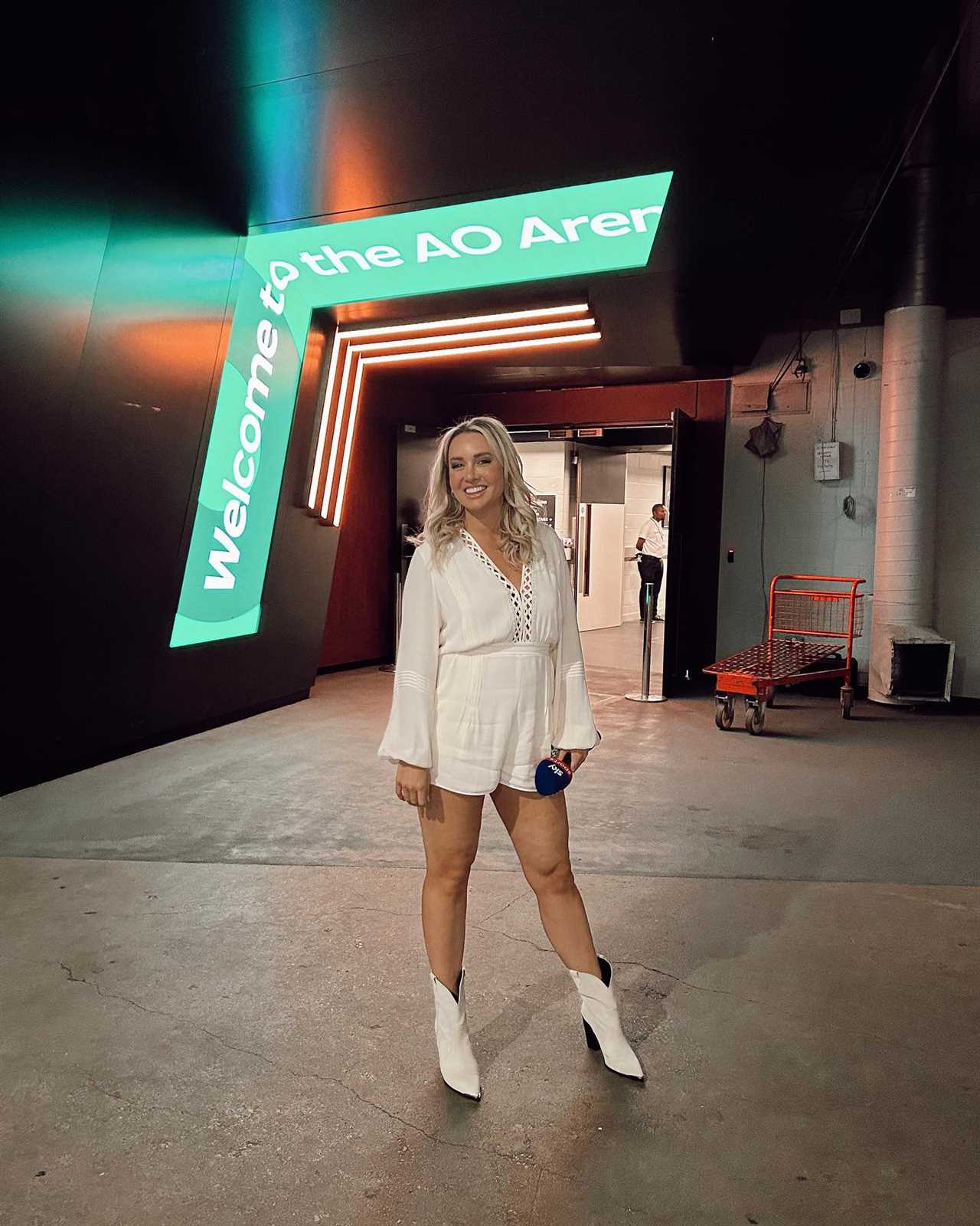 Sky Sports News' host reveals her cowboy boots while wearing a white playsuit. Fans are smitten.