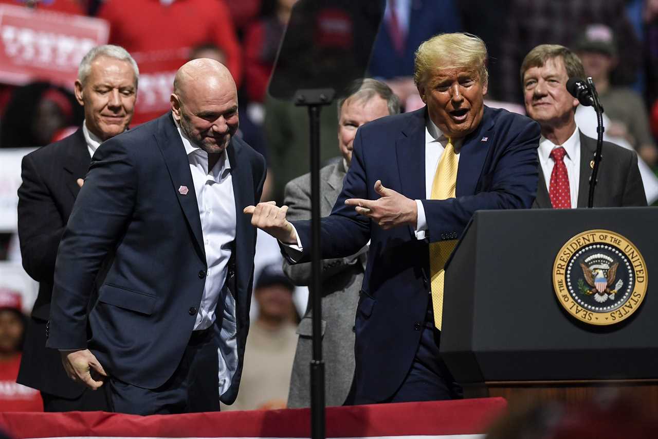 Donald Trump is greeted with wild cheers by MMA fans when he walks the UFC 290 Arena with Dana White