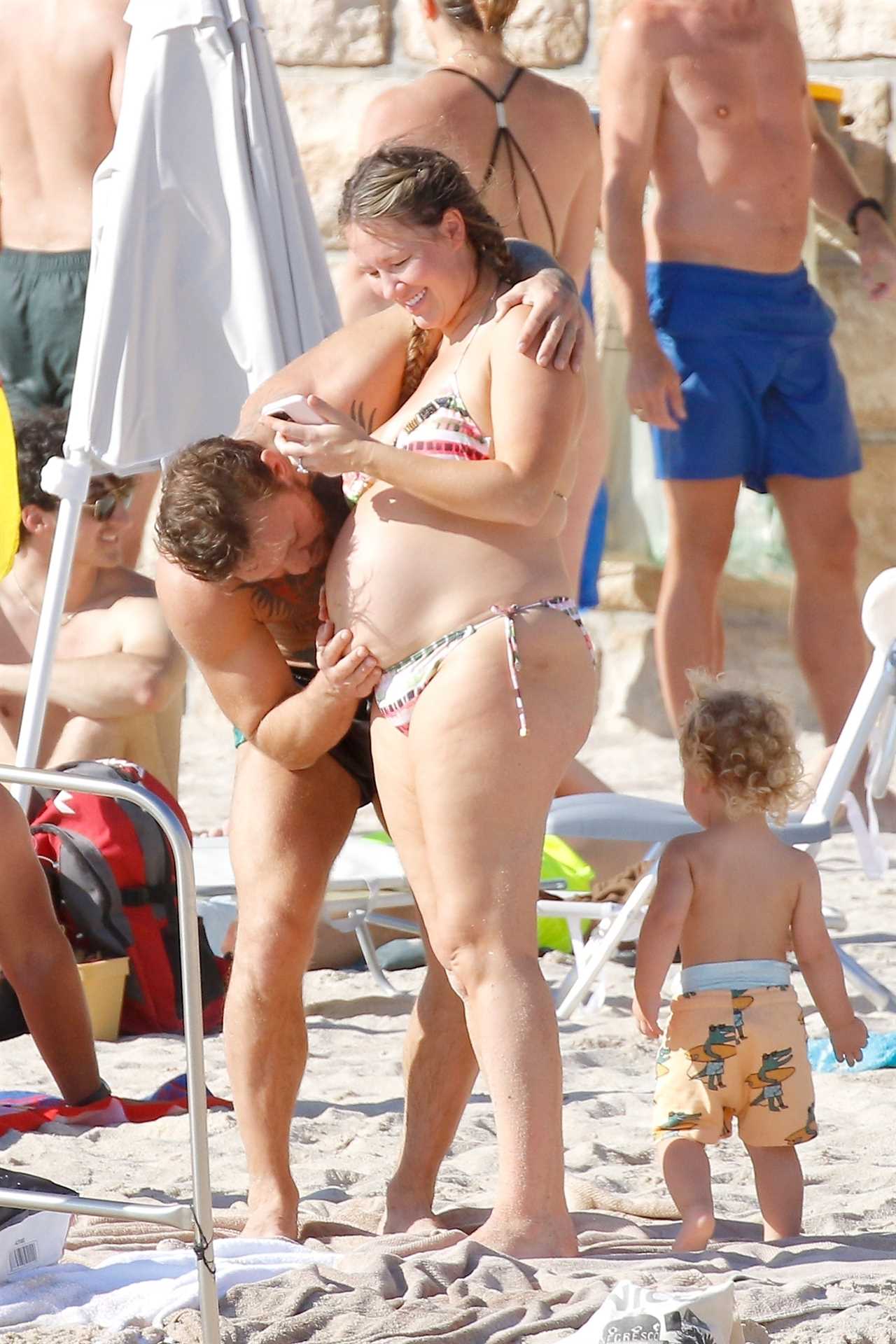Conor McGregor and his pregnant fiancée Dee Devlin show PDA on French Beach