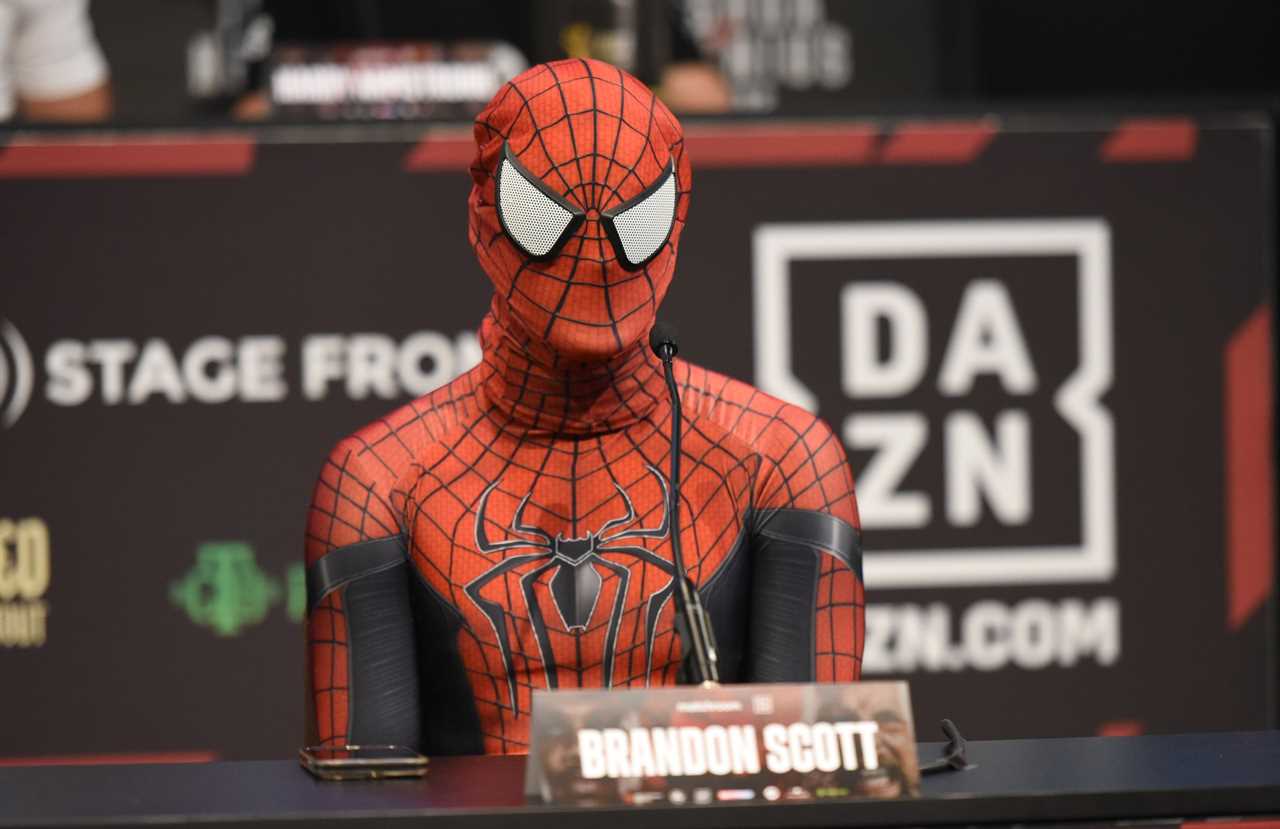 Brandon Scott, a'scrawny' nerd, dresses up as Spider-Man for a press conference and makes jokes about his manhood size compared to Anthony Joshua