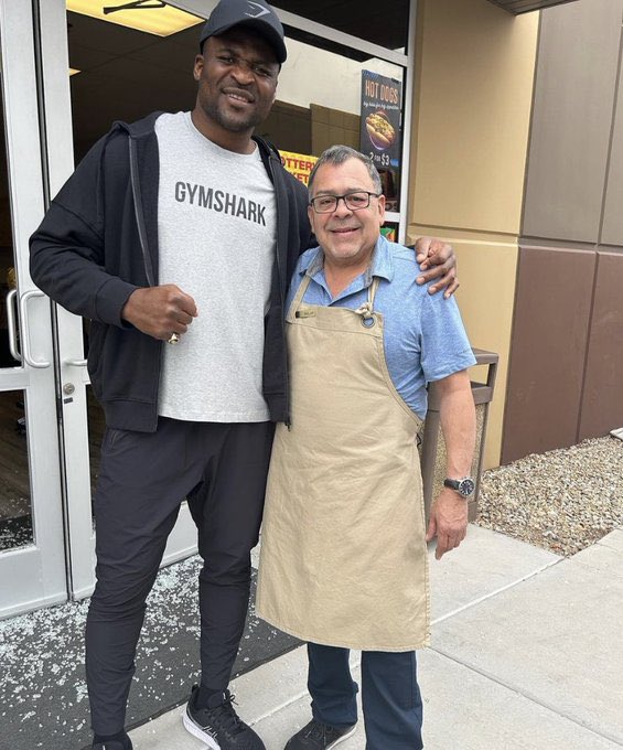 Watch this incredible moment as Tyson Fury's opponent Francis Ngannou SHATTERS a shop door by pushing it when he was supposed to pull.