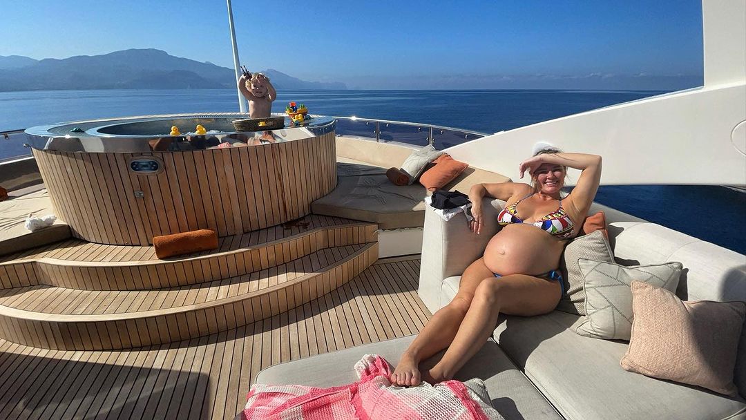 Conor McGregor relaxes on his PS2.7m Lamborghini Yacht with budgie smugglers and dressing gowns while on holiday with family.