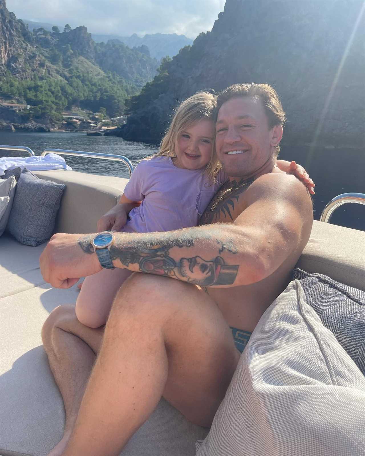 Conor McGregor relaxes on his PS2.7m Lamborghini Yacht with budgie smugglers and dressing gowns while on holiday with family.