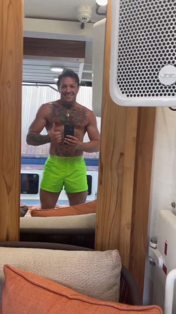 Conor McGregor relaxes on his PS2.7m Lamborghini Yacht with budgie smugglers and dressing gowns while on holiday with family.