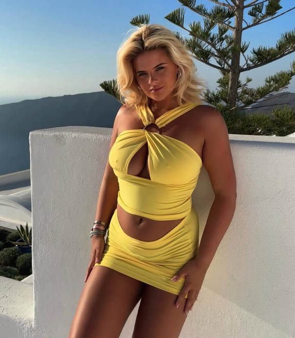 BOSSING Ring girl Apollonia Llewellyn risks Instagram ban with steamy yellow outfit