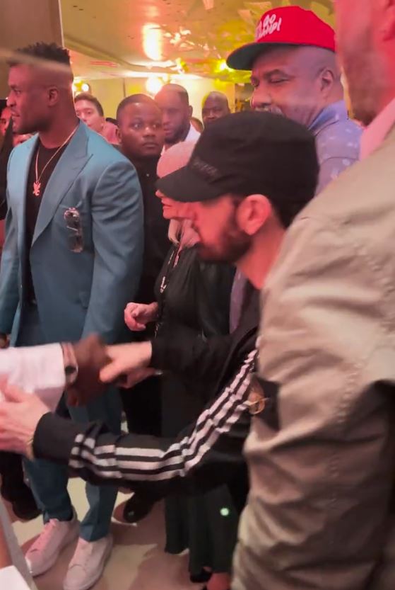 As the rap star arrives in Riyadh to fight Tyson Fury, Francis Ngannou nearly BLANKS Eminem.