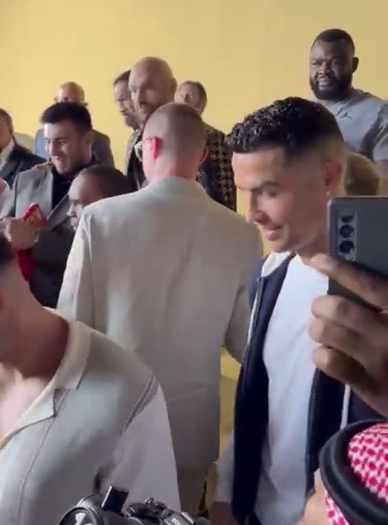 Fans Spot awkward Moment Tommy Fury Leaves Cristiano 'Waiting For A Handshake' After Posing Selfie