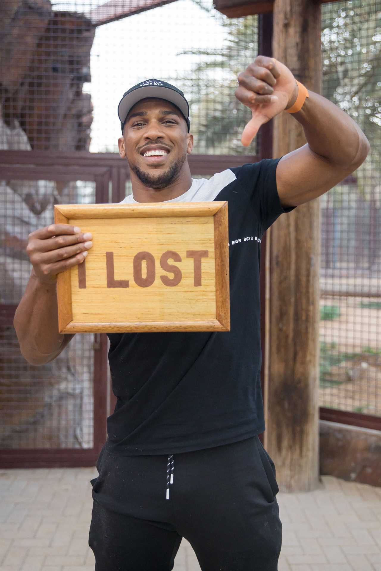 Anthony Joshua loses bizarre tug of war against a LIGER, but enjoys zoo trip with football legend