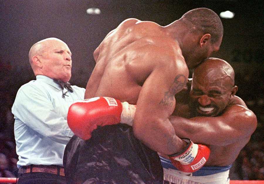 Mike Tyson's wife helps him recover PS2.3m lost for biting Evander holyfield's ear