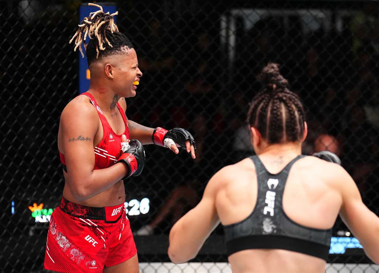 Female UFC fighter wins by boob-punch KO as star turns back mid-fight after rarely-seen move