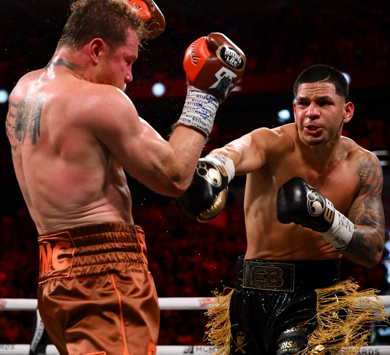 a boxer wearing a belt with the letter b on it