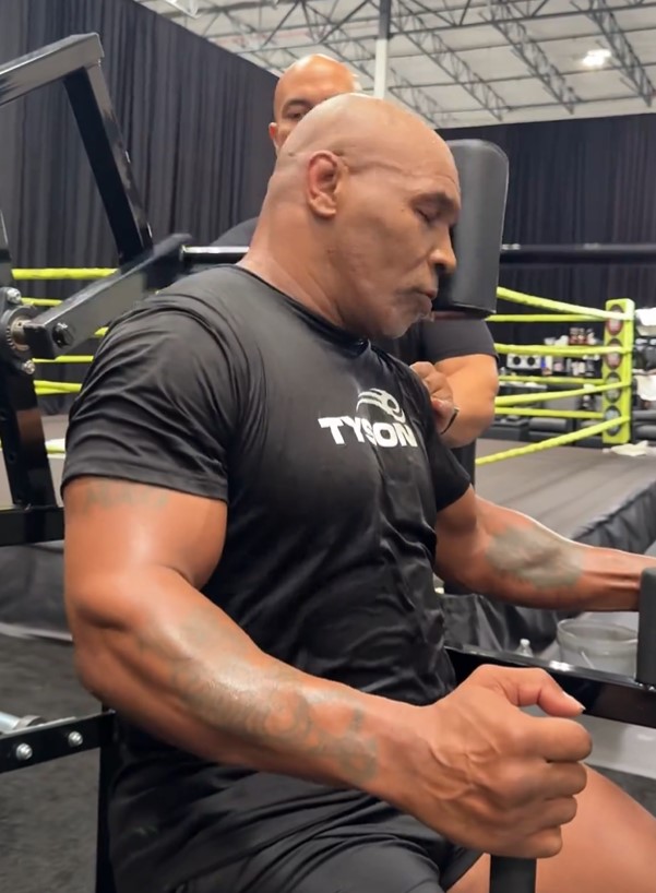 Mike Tyson, 58, flaunts intense NECK workouts and issues explicit warning to Jake Paul