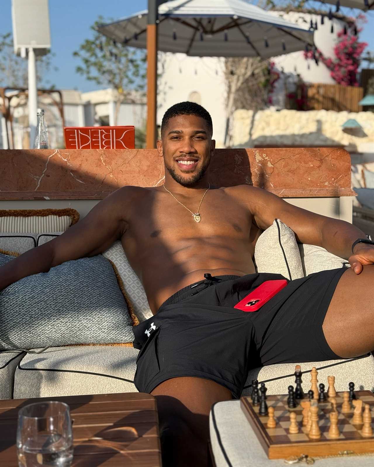 Anthony Joshua flaunts chiseled physique while playing chess amidst Tyson Fury fight rumors