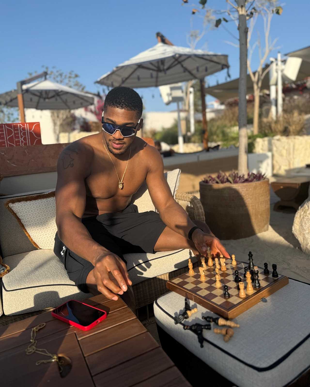 Anthony Joshua flaunts chiseled physique while playing chess amidst Tyson Fury fight rumors